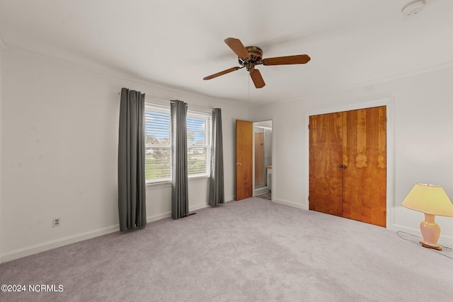 unfurnished room featuring light colored carpet and ceiling fan