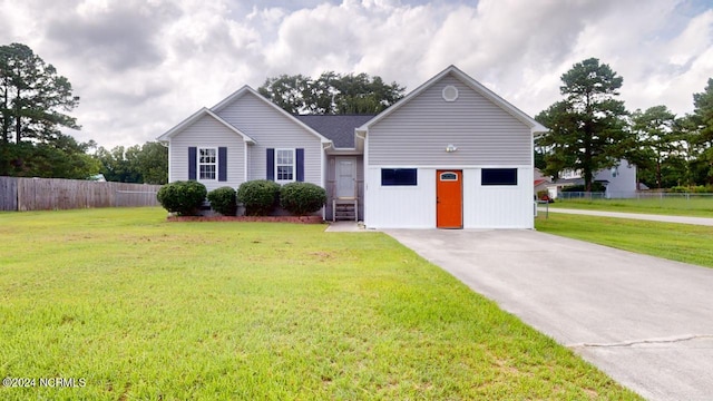 view of front of property featuring cooling unit and a front yard