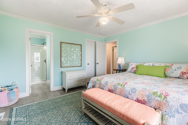 1409 Inlet St, Sunset Beach, NC 28468 - bedroom with wood finished floors, crown molding, baseboards, ceiling fan, and ensuite bath