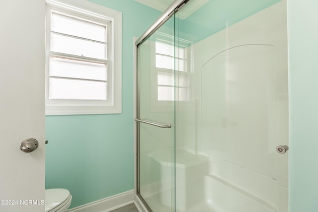 1409 Inlet St, Sunset Beach, NC 28468 - bathroom with a shower stall, toilet, and baseboards