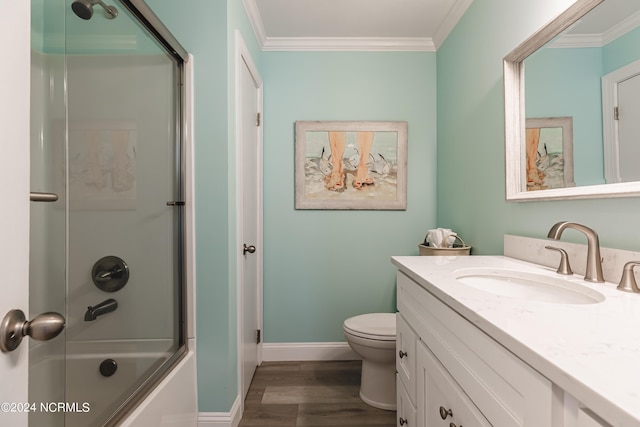1409 Inlet St, Sunset Beach, NC 28468 - bathroom featuring vanity, crown molding, baseboards, toilet, and wood finished floors