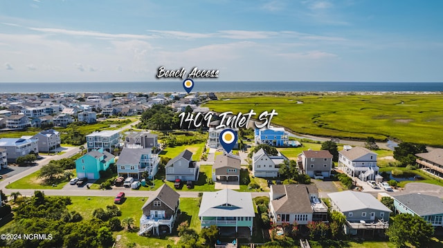 1409 Inlet St, Sunset Beach, NC 28468 - aerial perspective of suburban area featuring a nearby body of water
