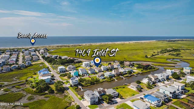 1409 Inlet St, Sunset Beach, NC 28468 - aerial view of property and surrounding area featuring a nearby body of water and nearby suburban area