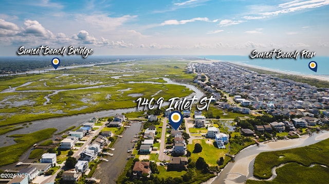 1409 Inlet St, Sunset Beach, NC 28468 - aerial view of property's location featuring a large body of water and nearby suburban area