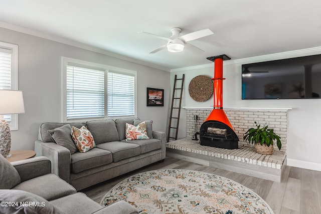1409 Inlet St, Sunset Beach, NC 28468 - living area featuring healthy amount of natural light, ceiling fan, ornamental molding, and wood finished floors