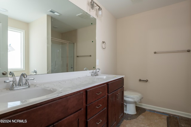 bathroom with vanity, toilet, and walk in shower