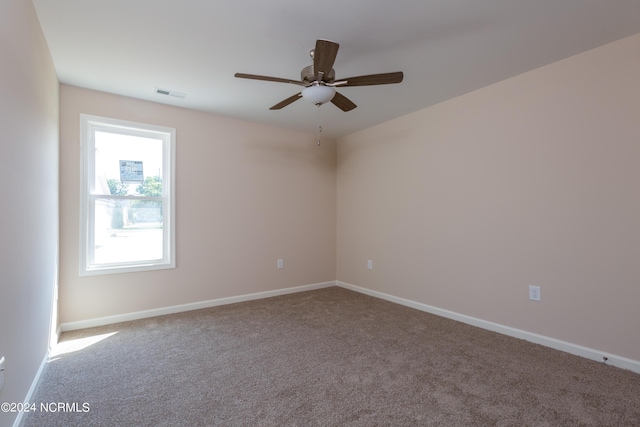 empty room with carpet floors and ceiling fan