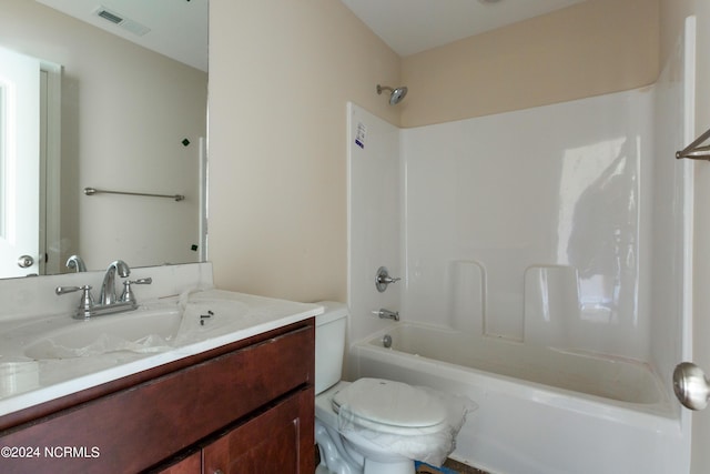 full bathroom with shower / bath combination, vanity, and toilet