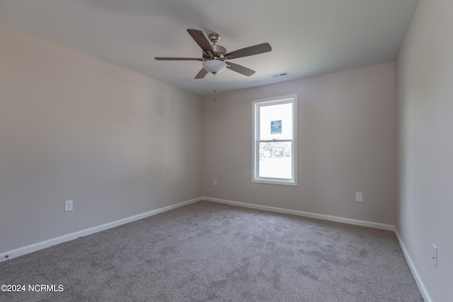 unfurnished room with carpet floors and ceiling fan