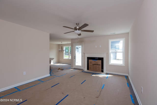 unfurnished living room featuring ceiling fan