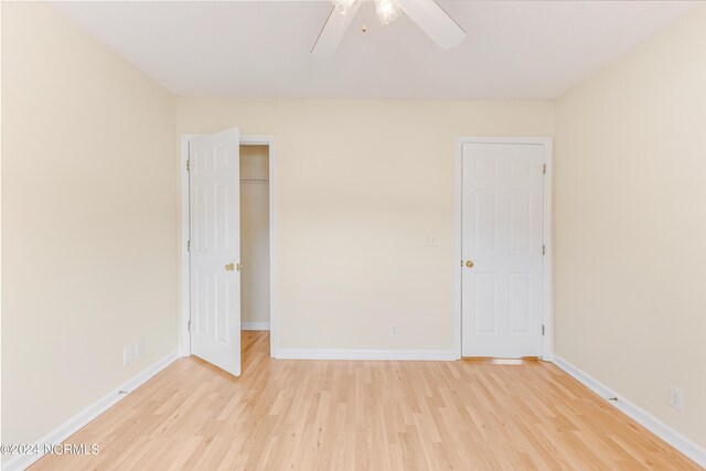 spare room featuring ceiling fan and light wood-type flooring