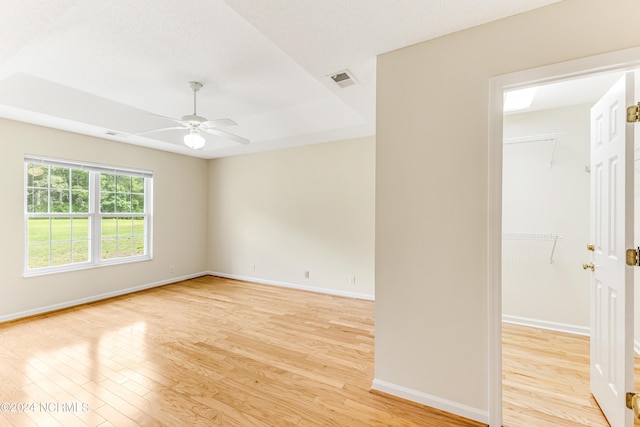 spare room with ceiling fan and light hardwood / wood-style floors