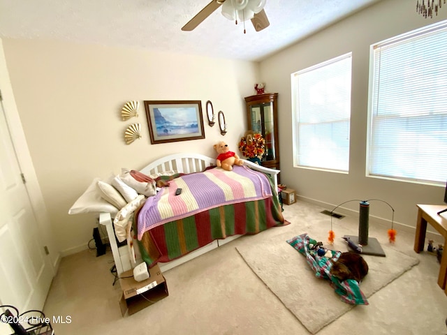 bedroom with ceiling fan and carpet floors