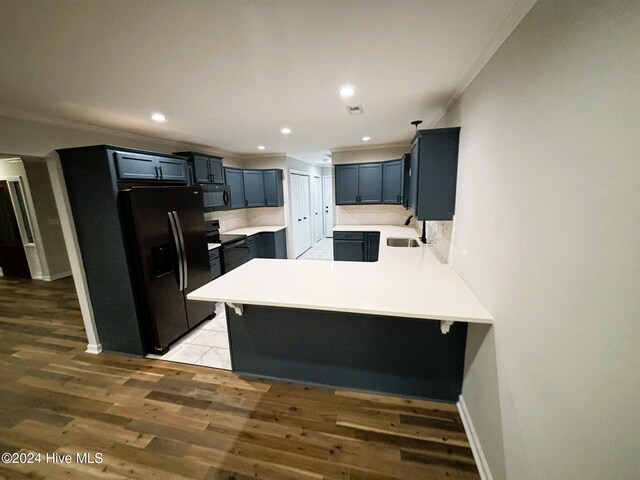 interior space featuring ceiling fan, dark hardwood / wood-style flooring, and ornamental molding