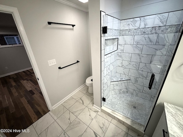 bathroom featuring toilet, ornamental molding, and walk in shower