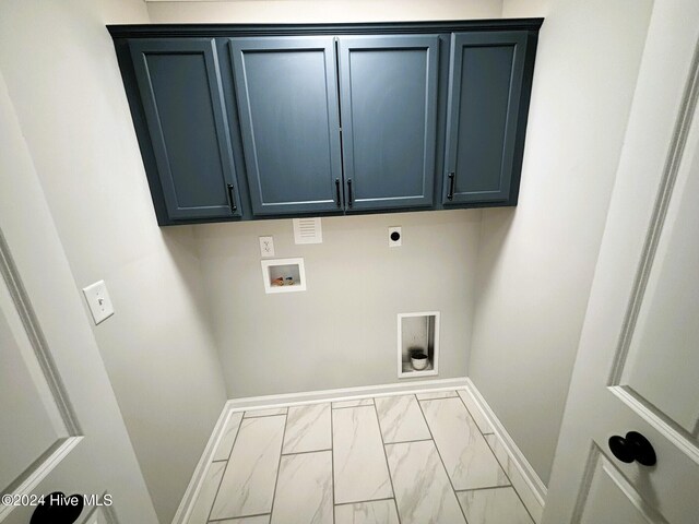 laundry area featuring hookup for an electric dryer, cabinets, crown molding, and hookup for a washing machine