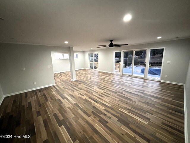 basement with ceiling fan and wood-type flooring