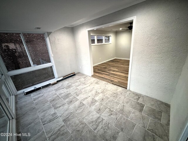 unfurnished living room with dark hardwood / wood-style flooring and crown molding