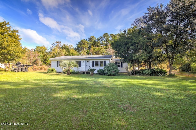 ranch-style house with a front lawn