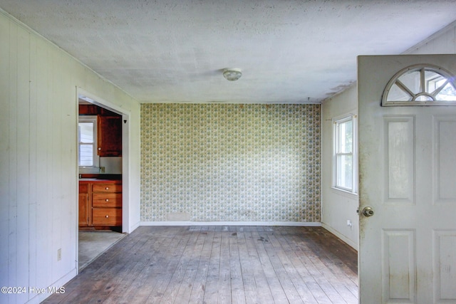 165 Polly Hill Rd, Marshallberg, NC 28553 - entrance foyer featuring hardwood / wood-style flooring, baseboards, plenty of natural light, and wallpapered walls