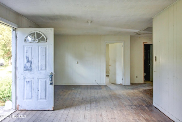 165 Polly Hill Rd, Marshallberg, NC 28553 - entryway featuring hardwood / wood-style floors and wooden walls