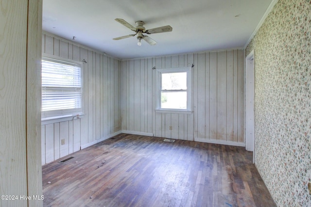 165 Polly Hill Rd, Marshallberg, NC 28553 - spare room with wood finished floors, ceiling fan, and crown molding