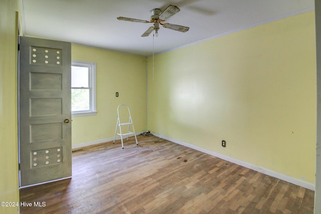 165 Polly Hill Rd, Marshallberg, NC 28553 - empty room featuring ceiling fan, baseboards, wood finished floors, and crown molding