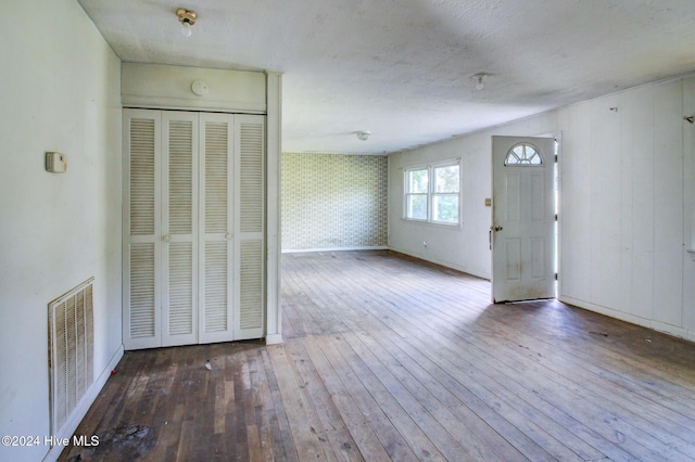 165 Polly Hill Rd, Marshallberg, NC 28553 - unfurnished living room featuring hardwood / wood-style flooring and baseboards