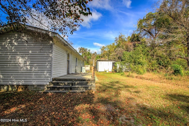 165 Polly Hill Rd, Marshallberg, NC 28553 - view of green lawn with a wooden deck