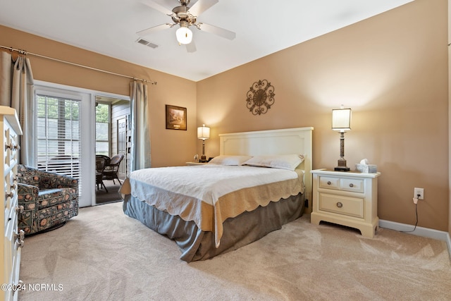 carpeted bedroom featuring ceiling fan and access to outside