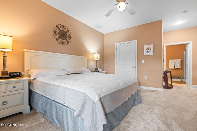 bedroom featuring light carpet and ceiling fan