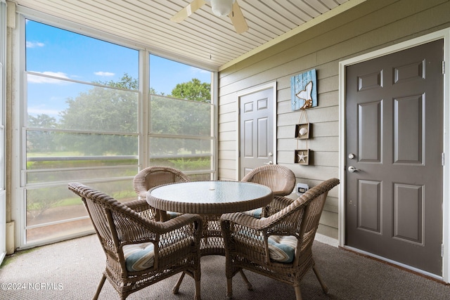 sunroom with ceiling fan and plenty of natural light