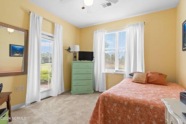 carpeted bedroom with ceiling fan