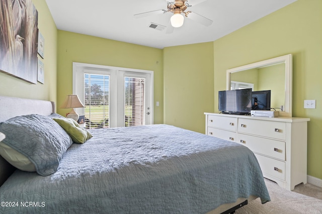 bedroom featuring access to exterior, light carpet, and ceiling fan