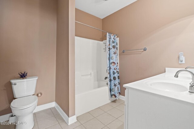 full bathroom with vanity, toilet, tile patterned floors, and shower / bath combo with shower curtain