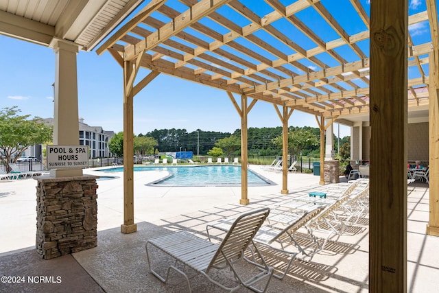 view of swimming pool with a pergola and a patio area