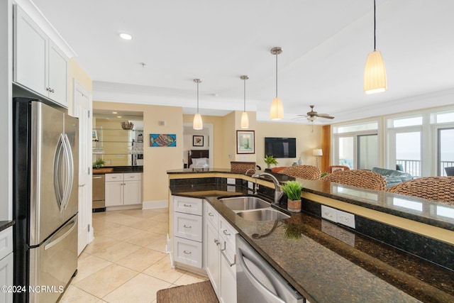 1435 Salter Path Rd Unit E7Grande, Villas, Indian Beach, NC 28512 - kitchen with stainless steel appliances, a sink, white cabinets, pendant lighting, and crown molding