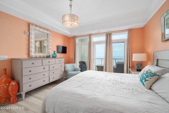 bedroom featuring crown molding and light wood-type flooring