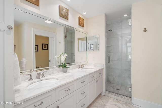 bathroom featuring vanity and a shower with door