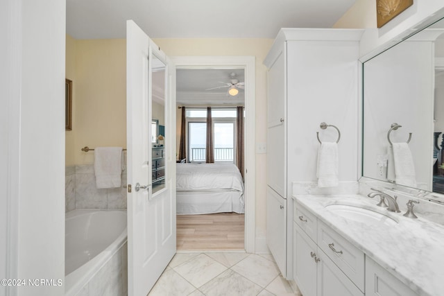 1435 Salter Path Rd Unit E7Grande, Villas, Indian Beach, NC 28512 - ensuite bathroom with vanity, ceiling fan, a tub to relax in, and marble look tiles
