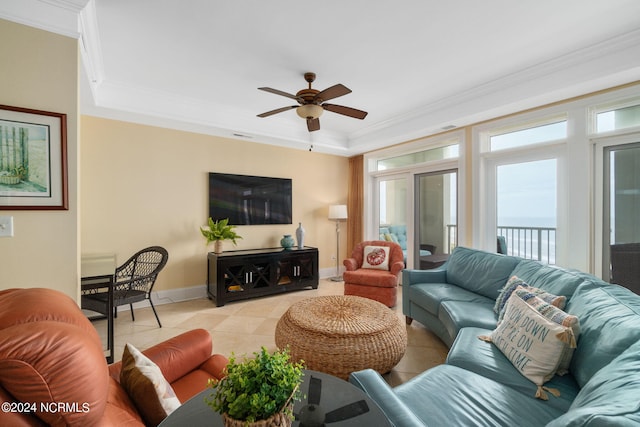 living room with crown molding, light tile patterned flooring, and ceiling fan