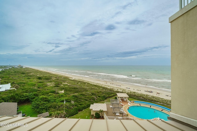 exterior space featuring a view of the beach and a water view