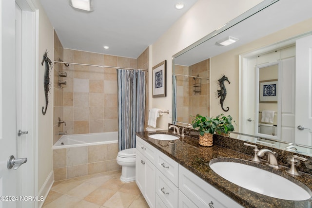 full bathroom featuring vanity, shower / bathtub combination with curtain, tile patterned floors, and toilet