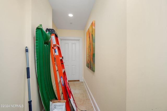 corridor featuring light tile patterned flooring