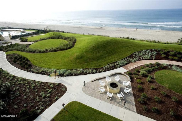 1435 Salter Path Rd Unit E7Grande, Villas, Indian Beach, NC 28512 - view of home's community with view of water and beach, a patio area, a fire pit, and a yard