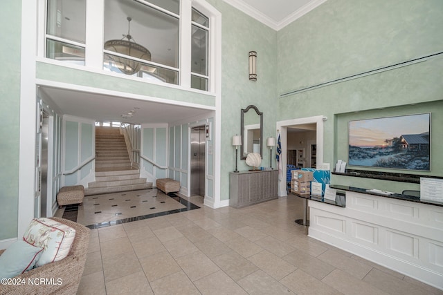 1435 Salter Path Rd Unit E7Grande, Villas, Indian Beach, NC 28512 - community lobby with a high ceiling, stairs, and crown molding