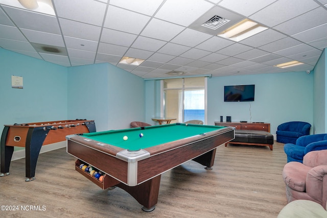 game room with billiards, hardwood / wood-style floors, and a drop ceiling