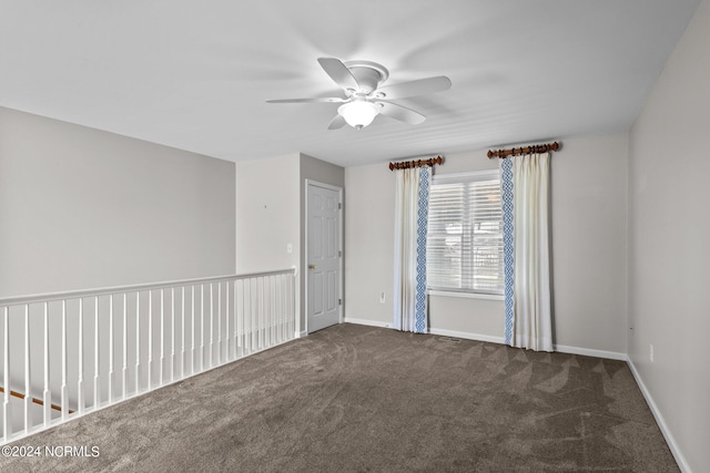 unfurnished room featuring ceiling fan and carpet