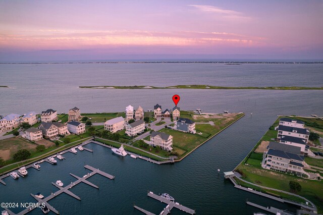 aerial view at dusk with a water view