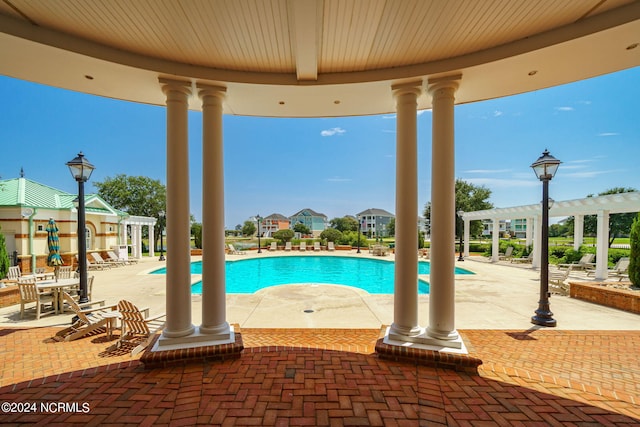 view of pool featuring a pergola and a patio